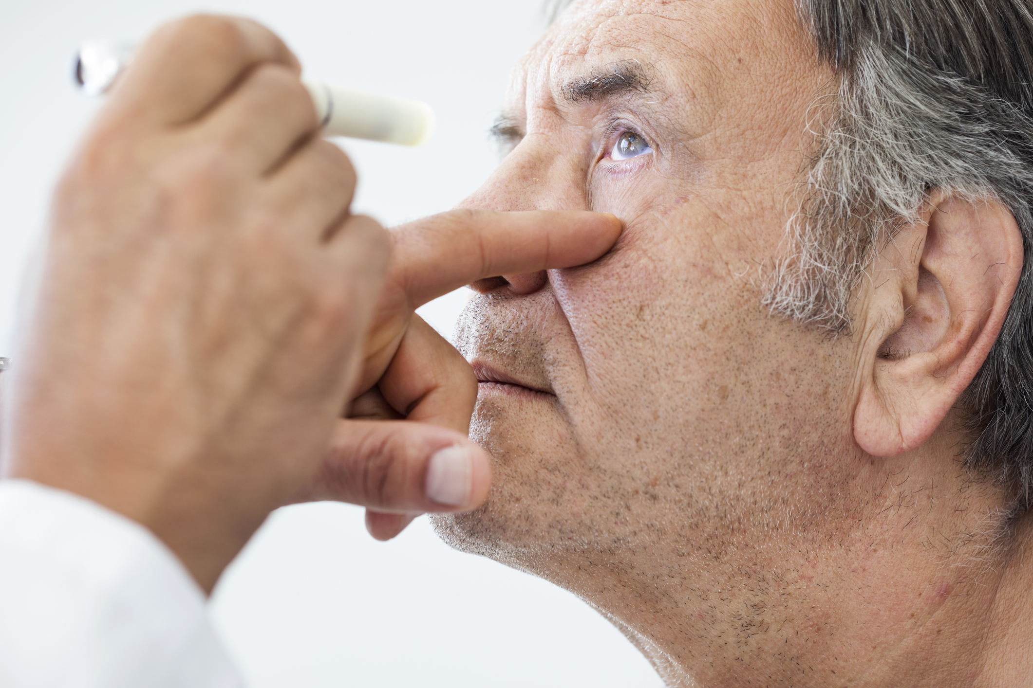 Doctor Analyzing Patients Cataracts in Atlanta